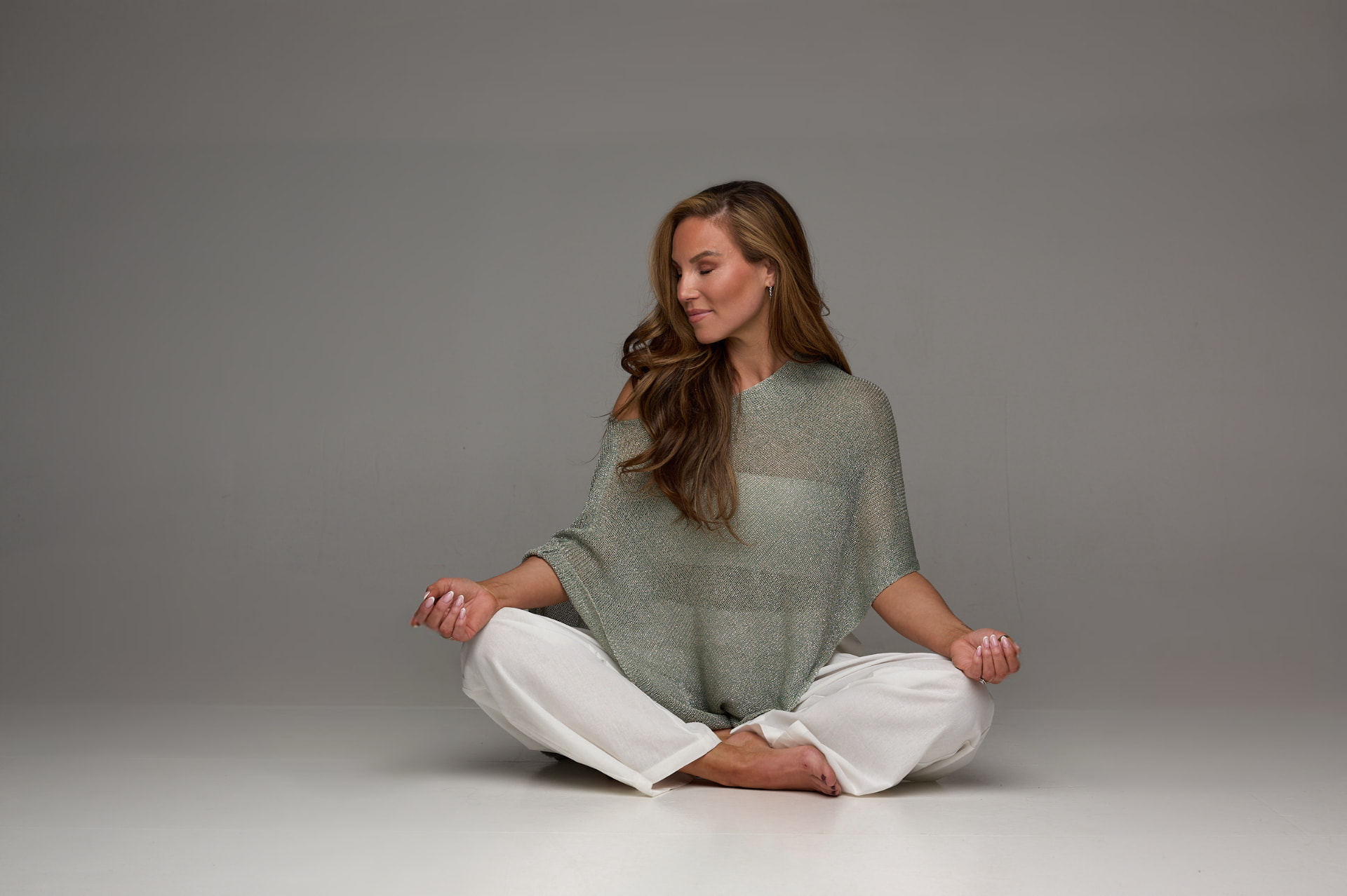 Maria Fagranes seated in meditation, calm and present